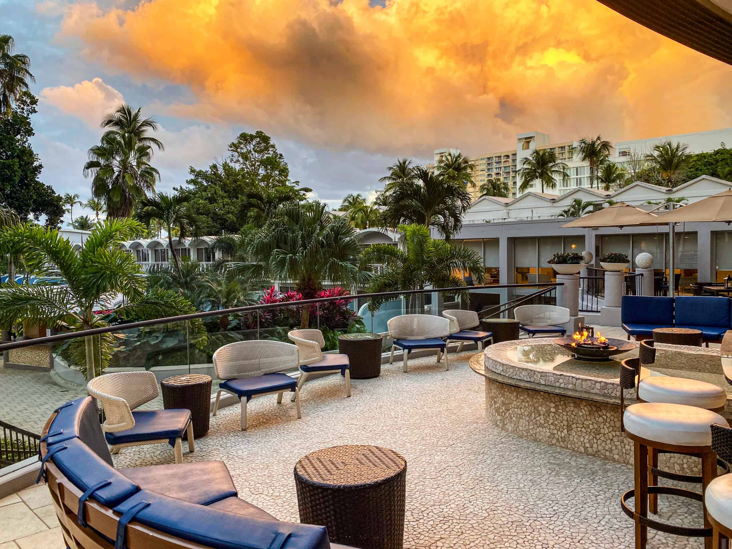The Westin Key West hotel exterior, showcasing tropical architecture and palm trees against a clear blue sky.
