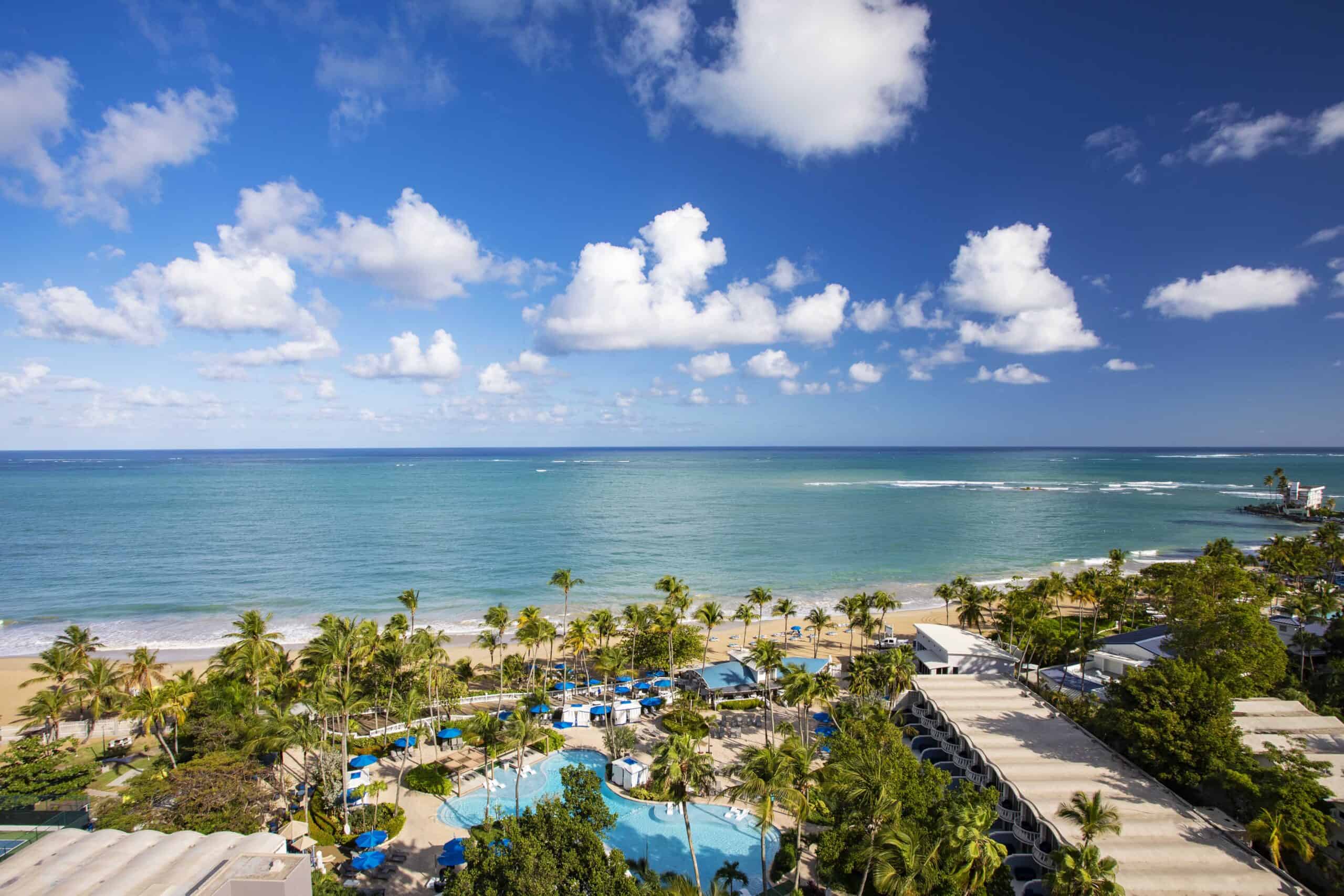Panoramic view from the Grande Marina Hotel in Puerto Rico, showcasing the coastline and vibrant cityscape below.