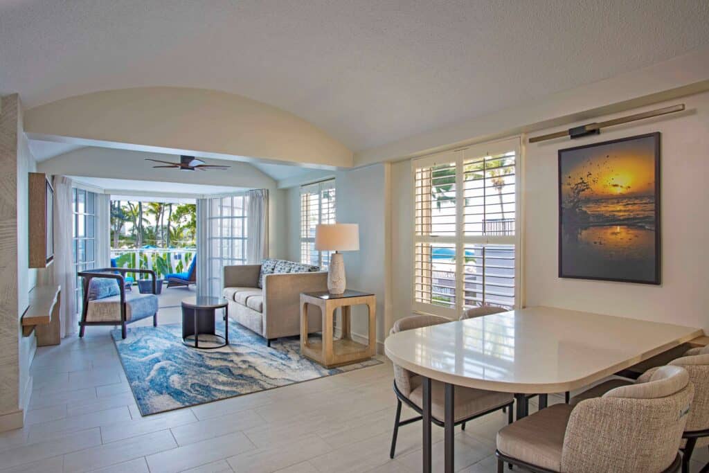 Living room and dining area of a condo featuring modern furniture and a cozy atmosphere with natural light.